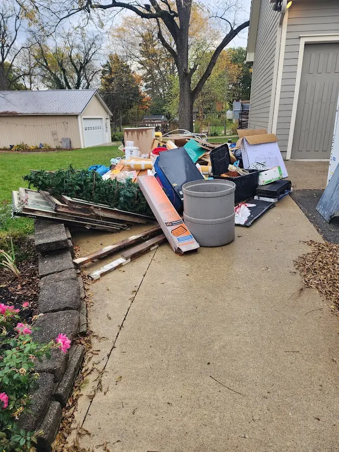 Dumpster being loaded with debris for Residential Dumpster Rental in Edwards